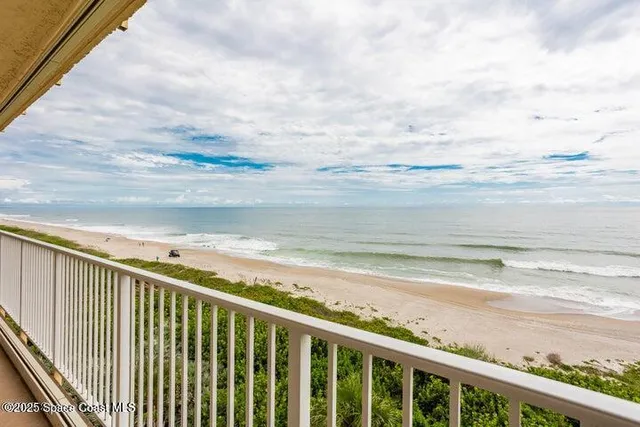 a kitchen with granite countertop a sink a counter top space cabinets and stainless steel appliances