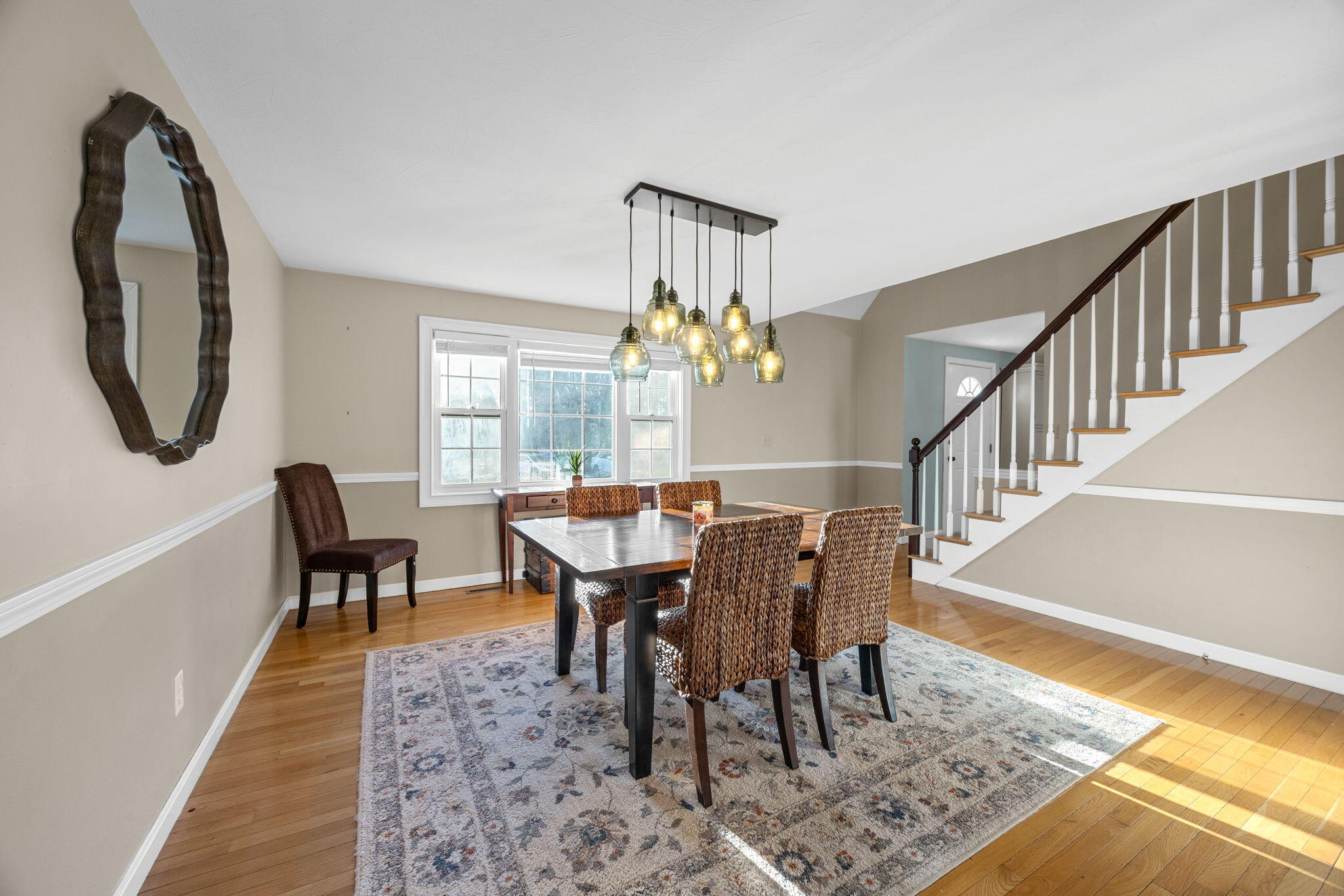 30 Flicker Lane Marstons Mills, MA 02648 - Photo 11 of 47 a view of a dining room with furniture and a rug