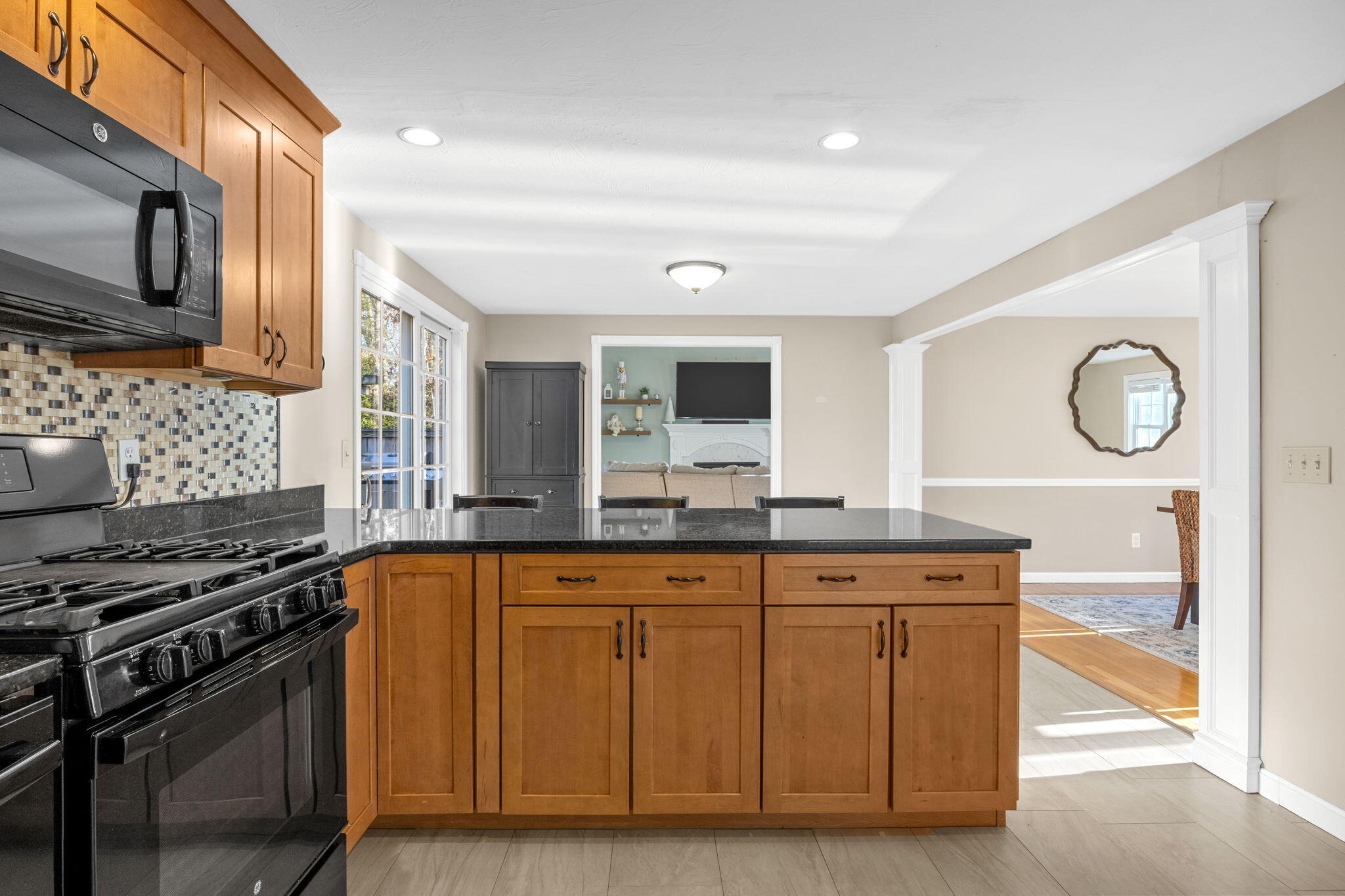 30 Flicker Lane Marstons Mills, MA 02648 - Photo 17 of 47 a kitchen with stainless steel appliances granite countertop a stove and a microwave
