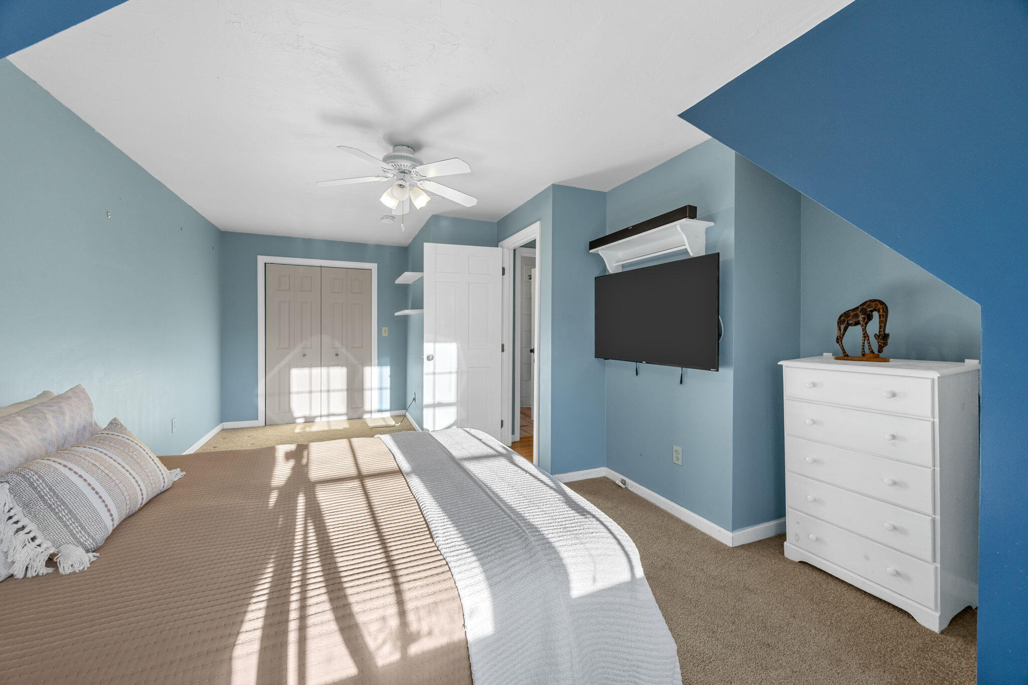 30 Flicker Lane Marstons Mills, MA 02648 - Photo 30 of 47 a bedroom with a large bed and a flat tv screen on dresser