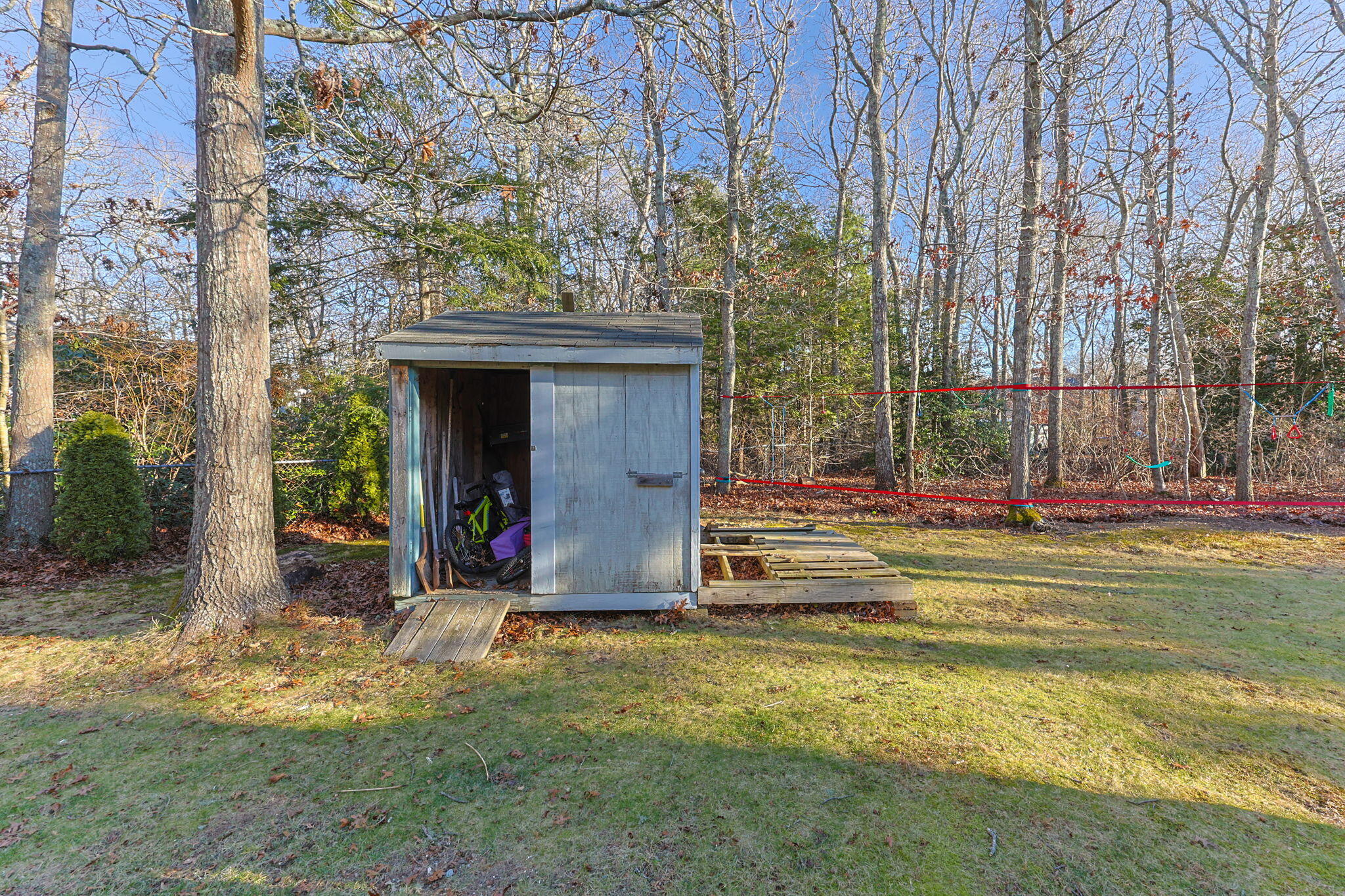 30 Flicker Lane Marstons Mills, MA 02648 - Photo 38 of 47 a view of a house with large trees and plants