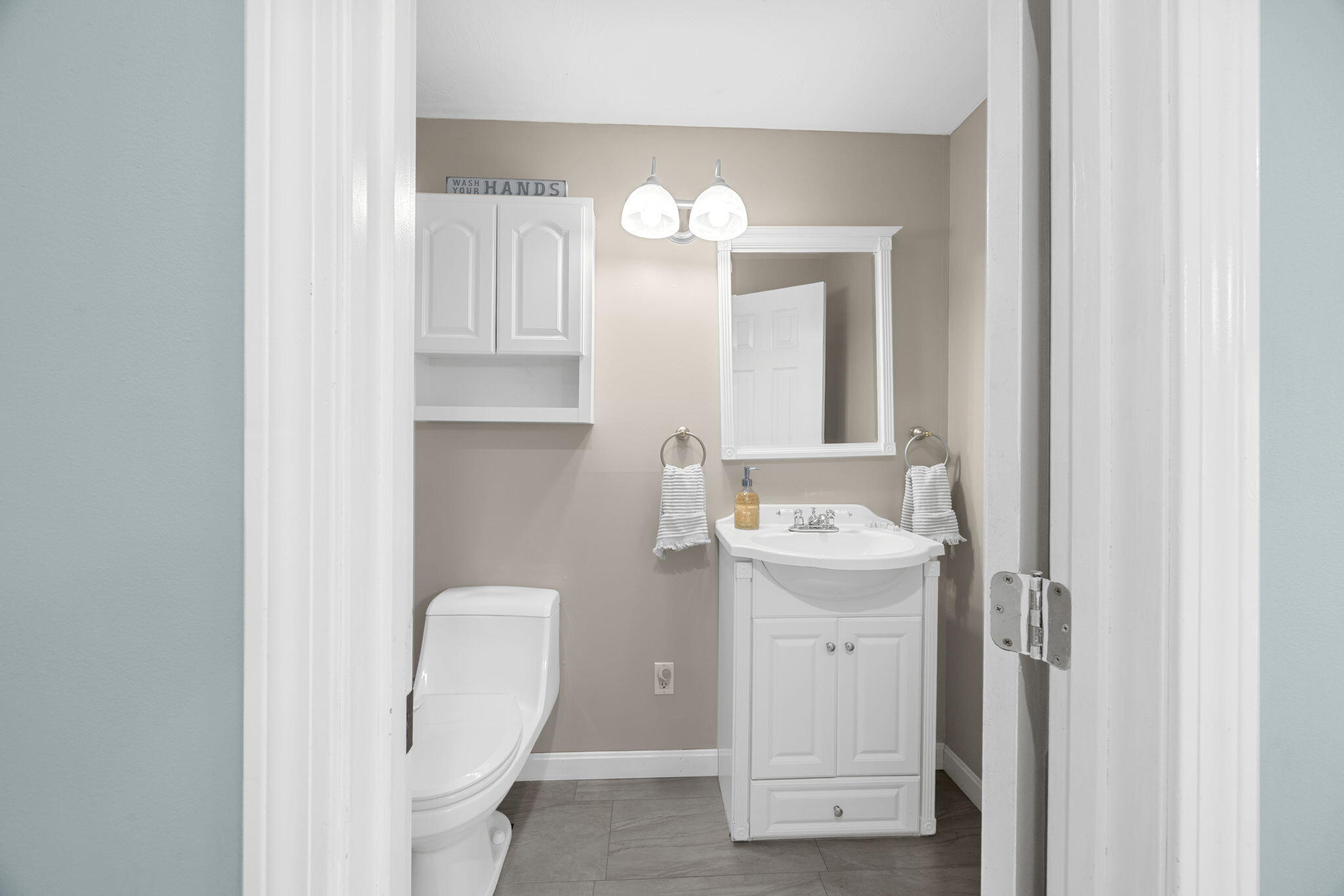 30 Flicker Lane Marstons Mills, MA 02648 - Photo 7 of 47 a bathroom with a sink mirror and vanity