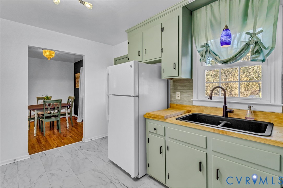 151 Badger Road Deltaville, VA 23043 - Photo 11 of 39 Kitchen featuring green cabinets, light countertop