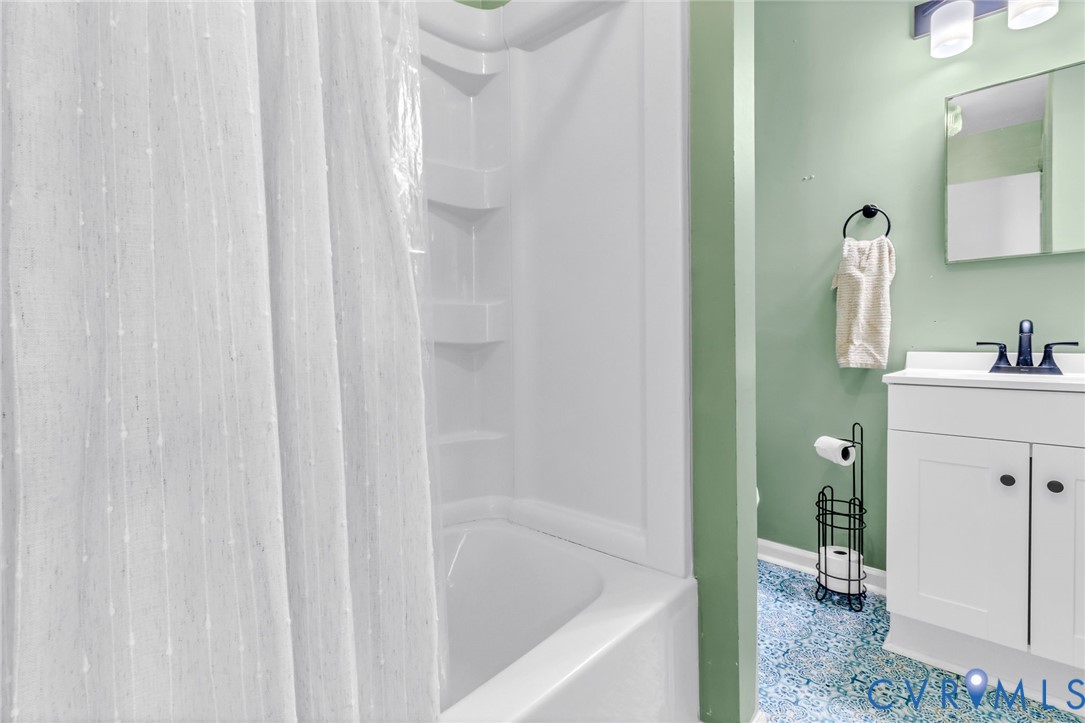 151 Badger Road Deltaville, VA 23043 - Photo 19 of 39 Full bath featuring vanity and shower / tub combo