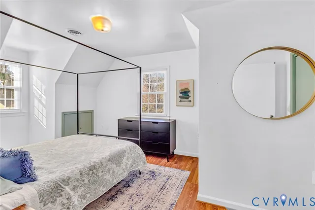 a bedroom with a bed and a table in it