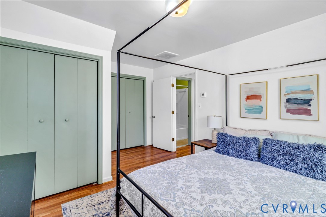 151 Badger Road Deltaville, VA 23043 - Photo 21 of 39 Bedroom featuring light wood finished floors, a cl