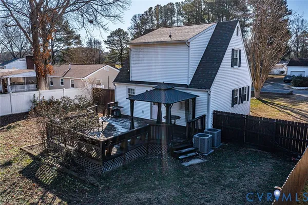 a view of a house with a yard patio and fire pit