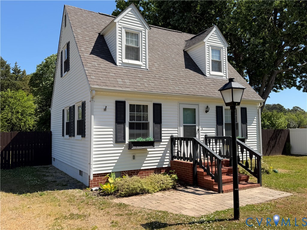 151 Badger Road Deltaville, VA 23043 - Photo 3 of 43 a view of a house with wooden fence next to a yard