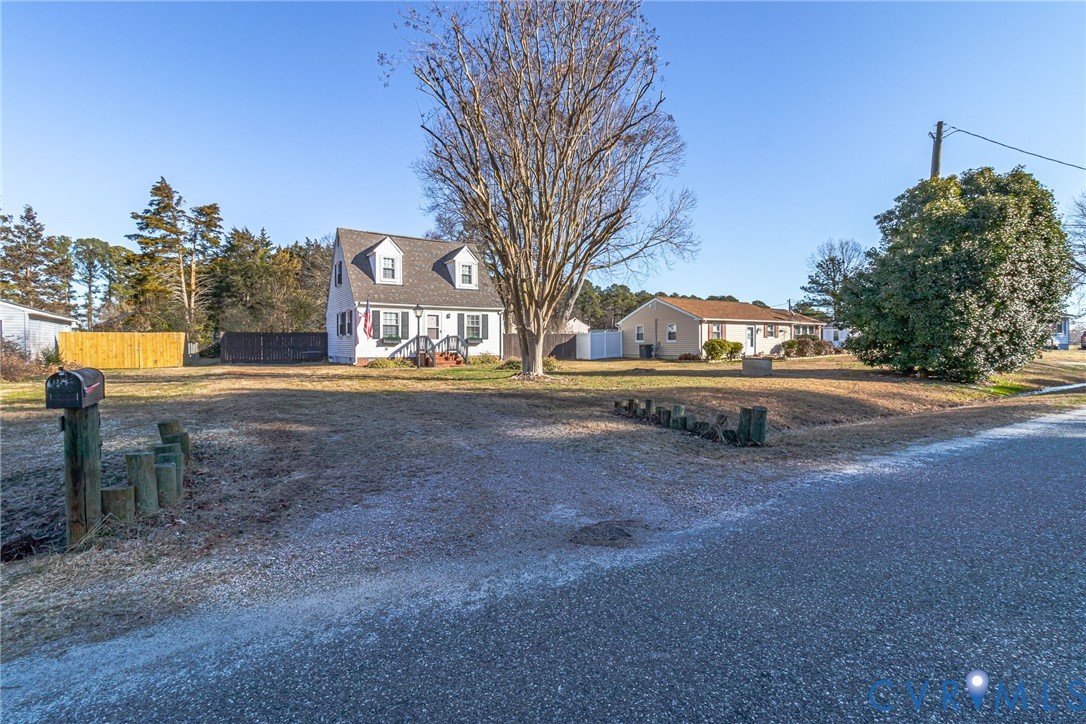 151 Badger Road Deltaville, VA 23043 - Photo 32 of 43 a view of road with large trees