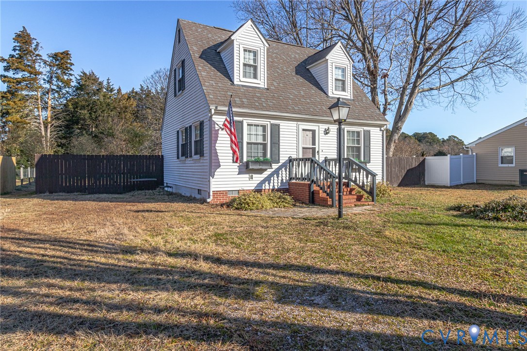 151 Badger Road Deltaville, VA 23043 - Photo 33 of 43 a view of a house with a yard patio and fire pit