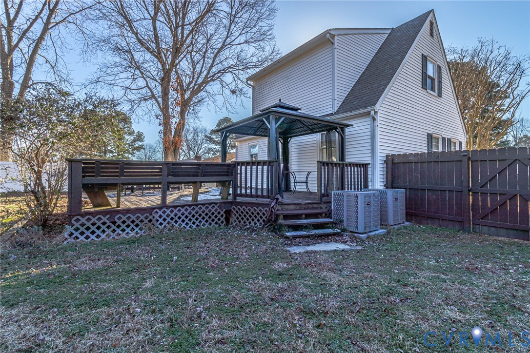 151 Badger Road Deltaville, VA 23043 - Photo 36 of 39 Rear view of house with a gazebo, a wooden deck, a