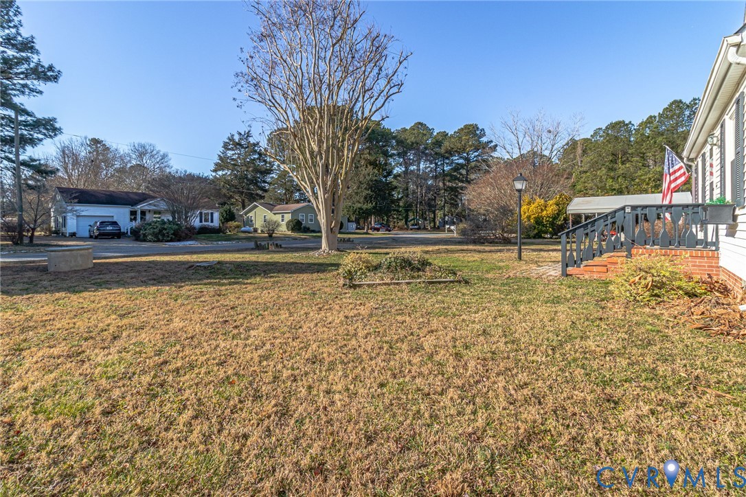 151 Badger Road Deltaville, VA 23043 - Photo 41 of 43 a view of a swimming pool with an outdoor space and seating area