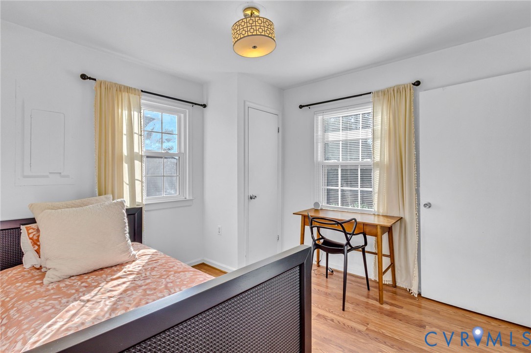 151 Badger Road Deltaville, VA 23043 - Photo 7 of 39 Bedroom featuring light wood-style floors, multipl