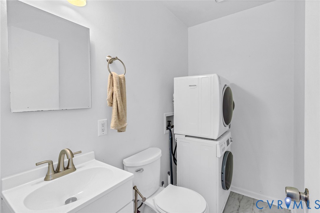 151 Badger Road Deltaville, VA 23043 - Photo 10 of 43 a white toilet sitting next to a bathroom sink