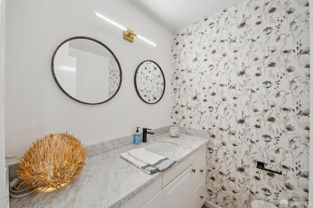a kitchen with stainless steel appliances granite countertop a sink and cabinets