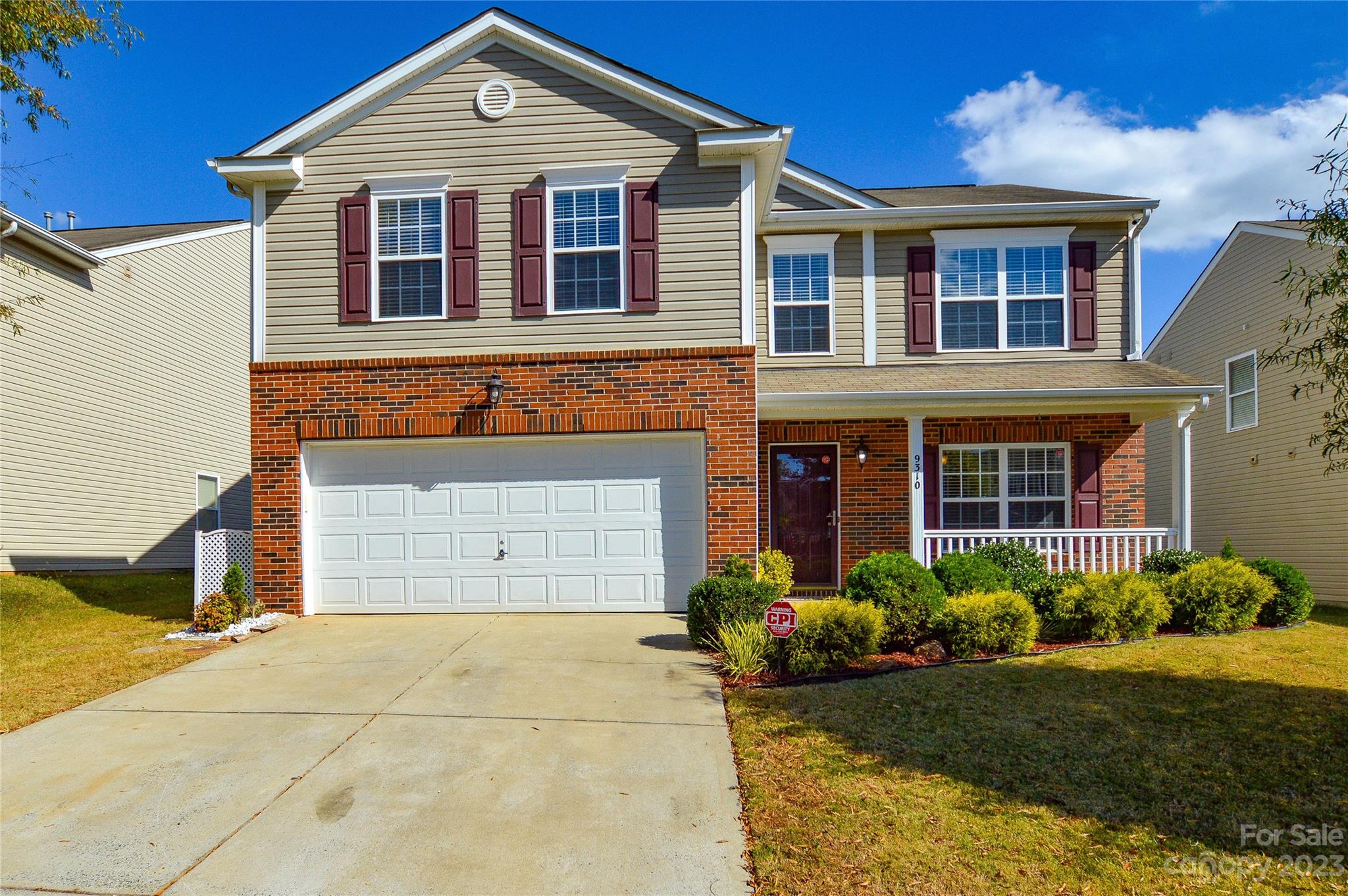 9310 John Russell Road Charlotte, NC 28215 - Photo 1 of 40 a front view of a house with garden