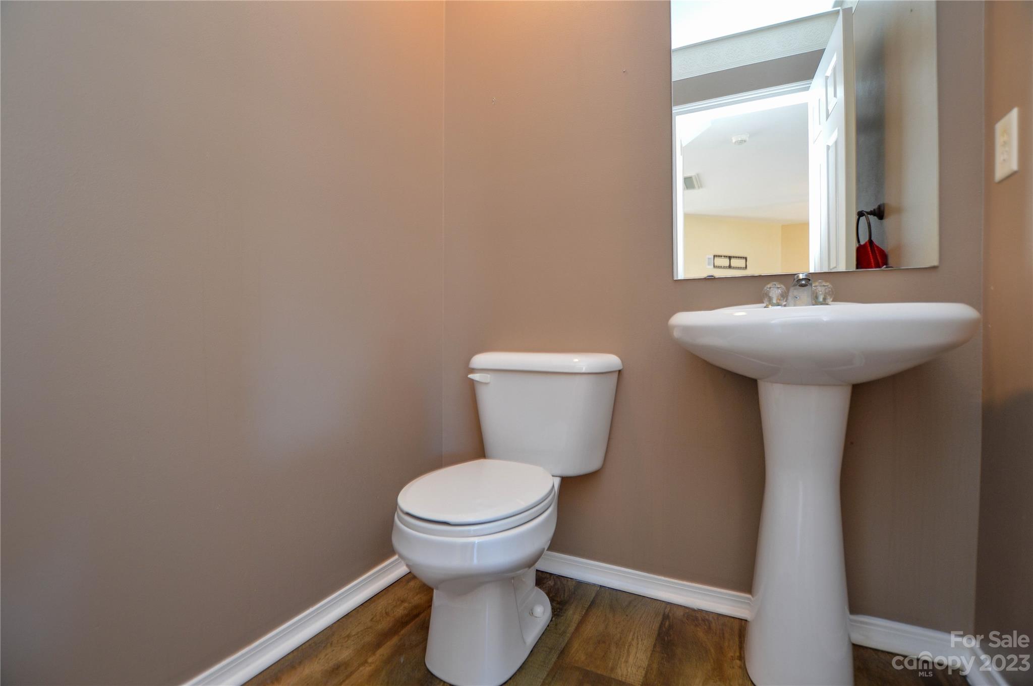 9310 John Russell Road Charlotte, NC 28215 - Photo 20 of 40 a bathroom with a toilet and a sink