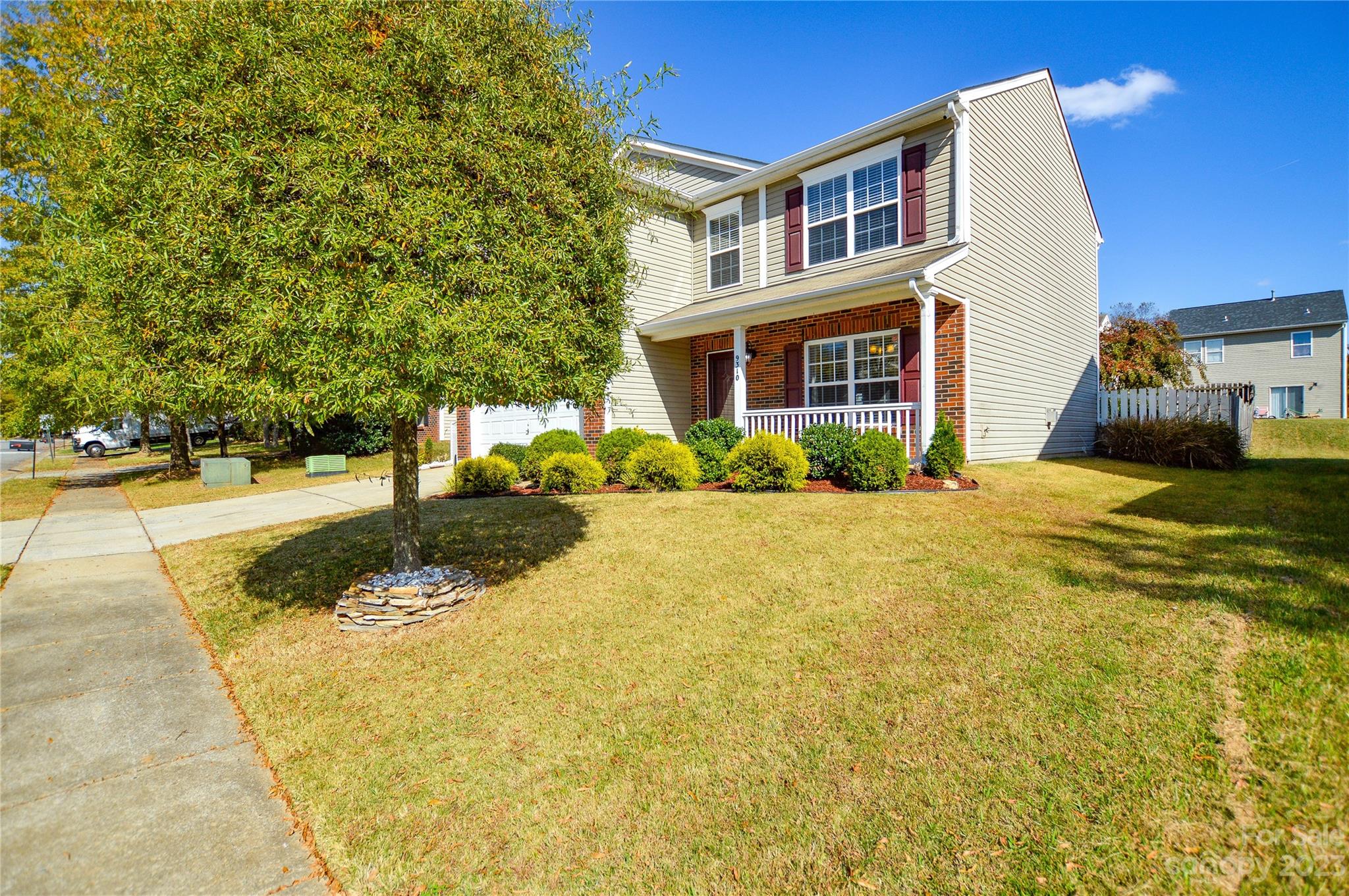 9310 John Russell Road Charlotte, NC 28215 - Photo 3 of 40 a front view of a house with a yard