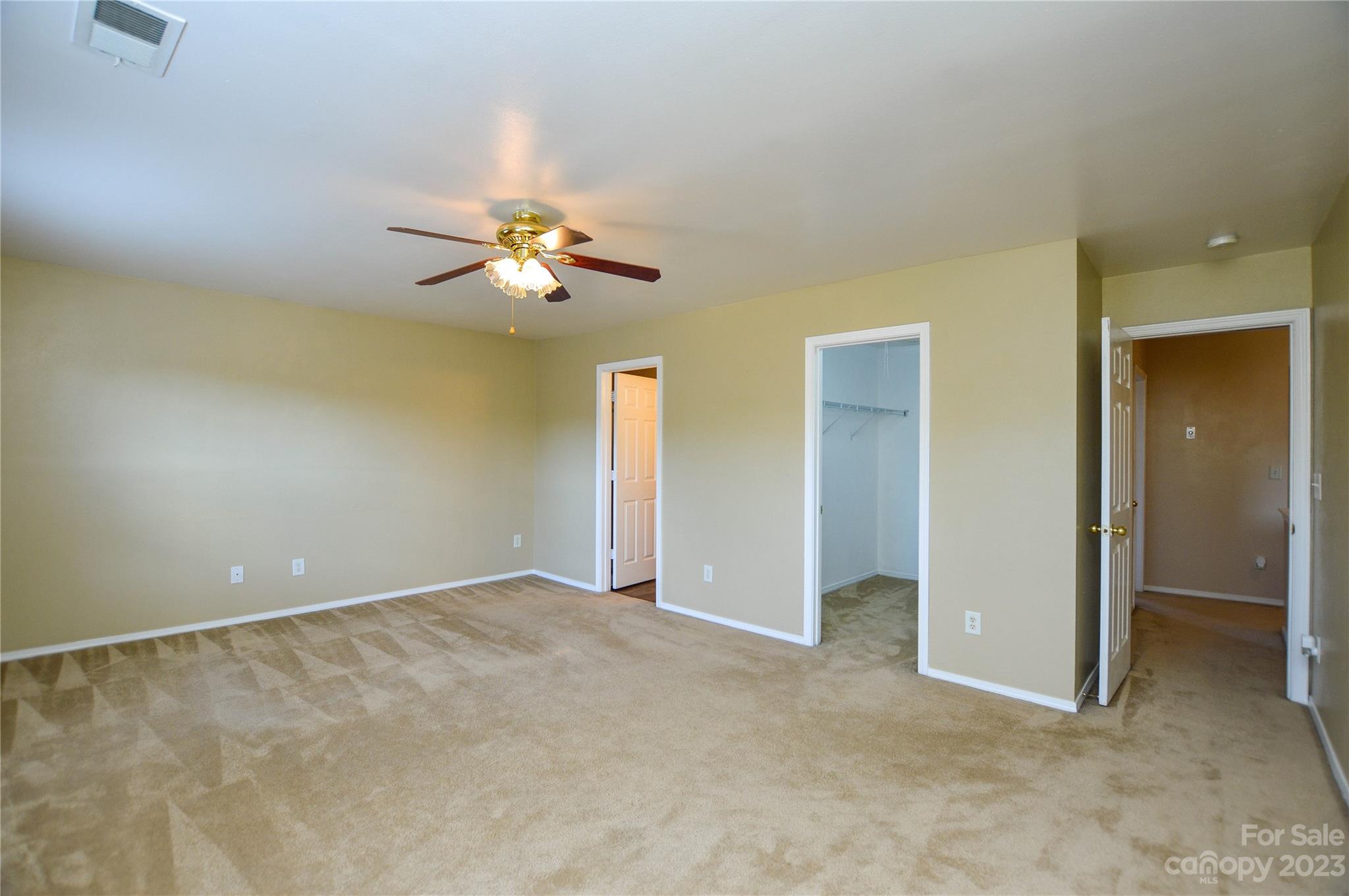 9310 John Russell Road Charlotte, NC 28215 - Photo 31 of 40 a view of an empty room with a ceiling fan