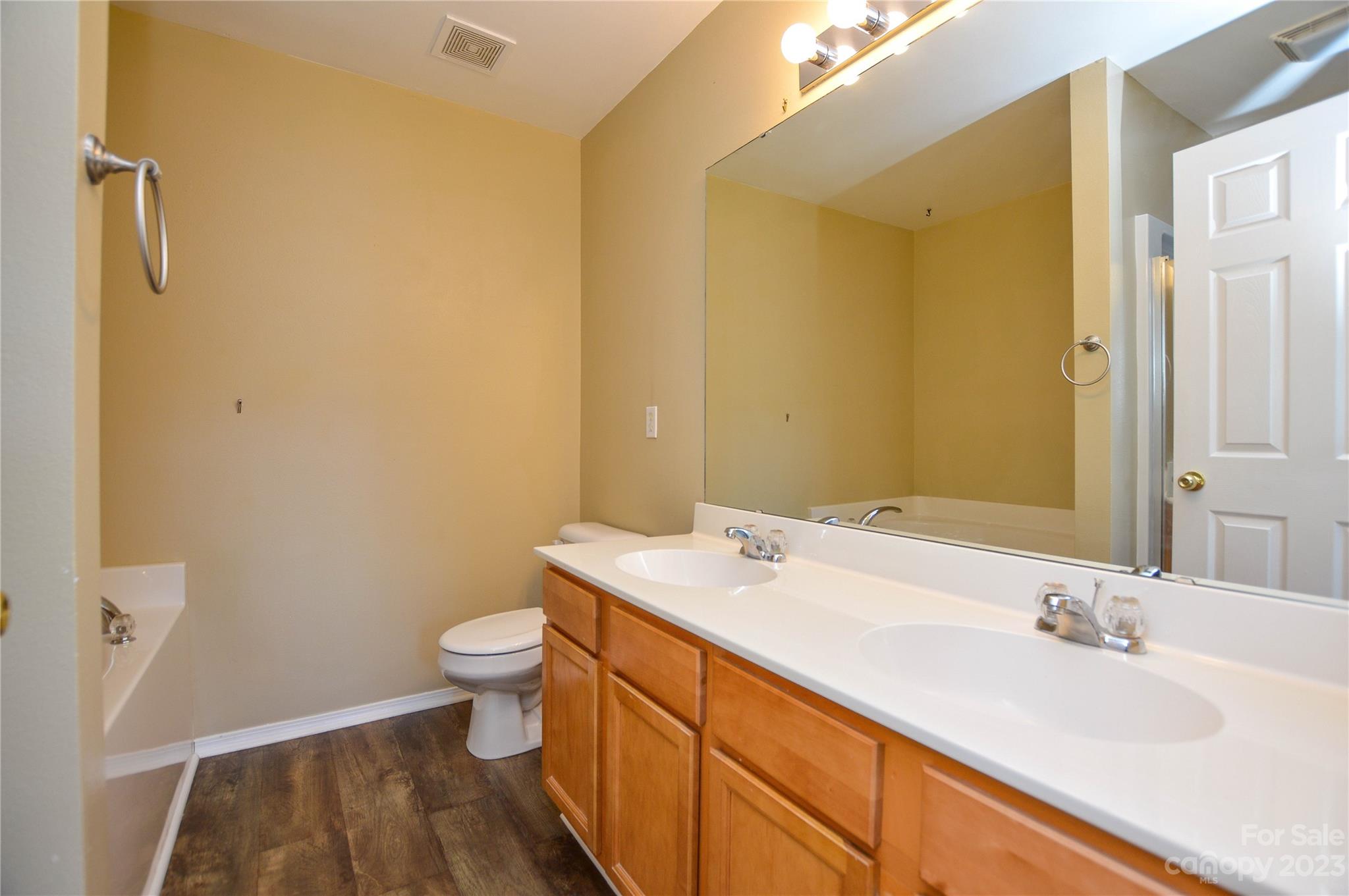 9310 John Russell Road Charlotte, NC 28215 - Photo 34 of 40 a bathroom with a sink and a mirror
