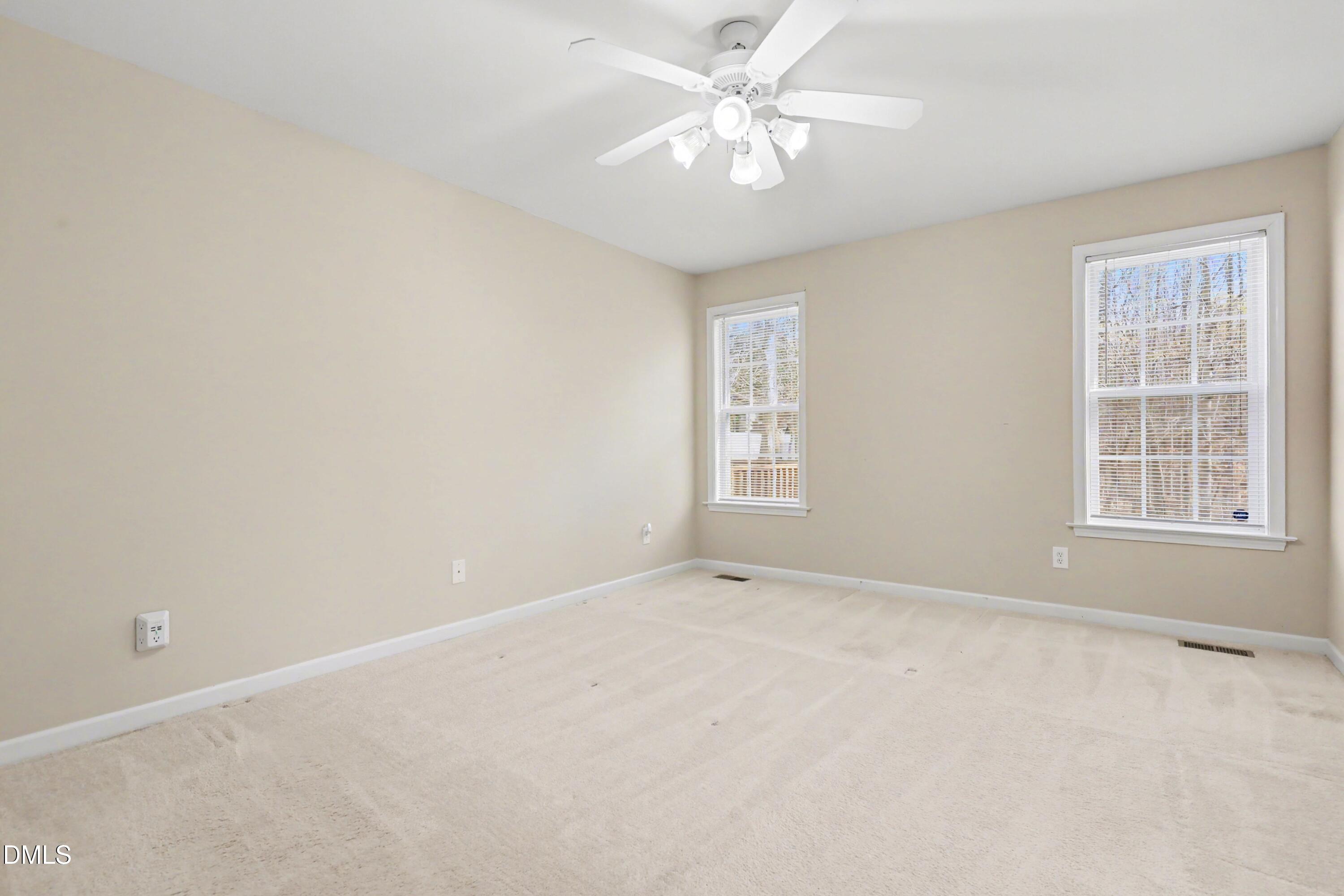 390 Eagle Stone Ridge Youngsville, NC 27596 - Photo 15 of 29 an empty room with windows and fan