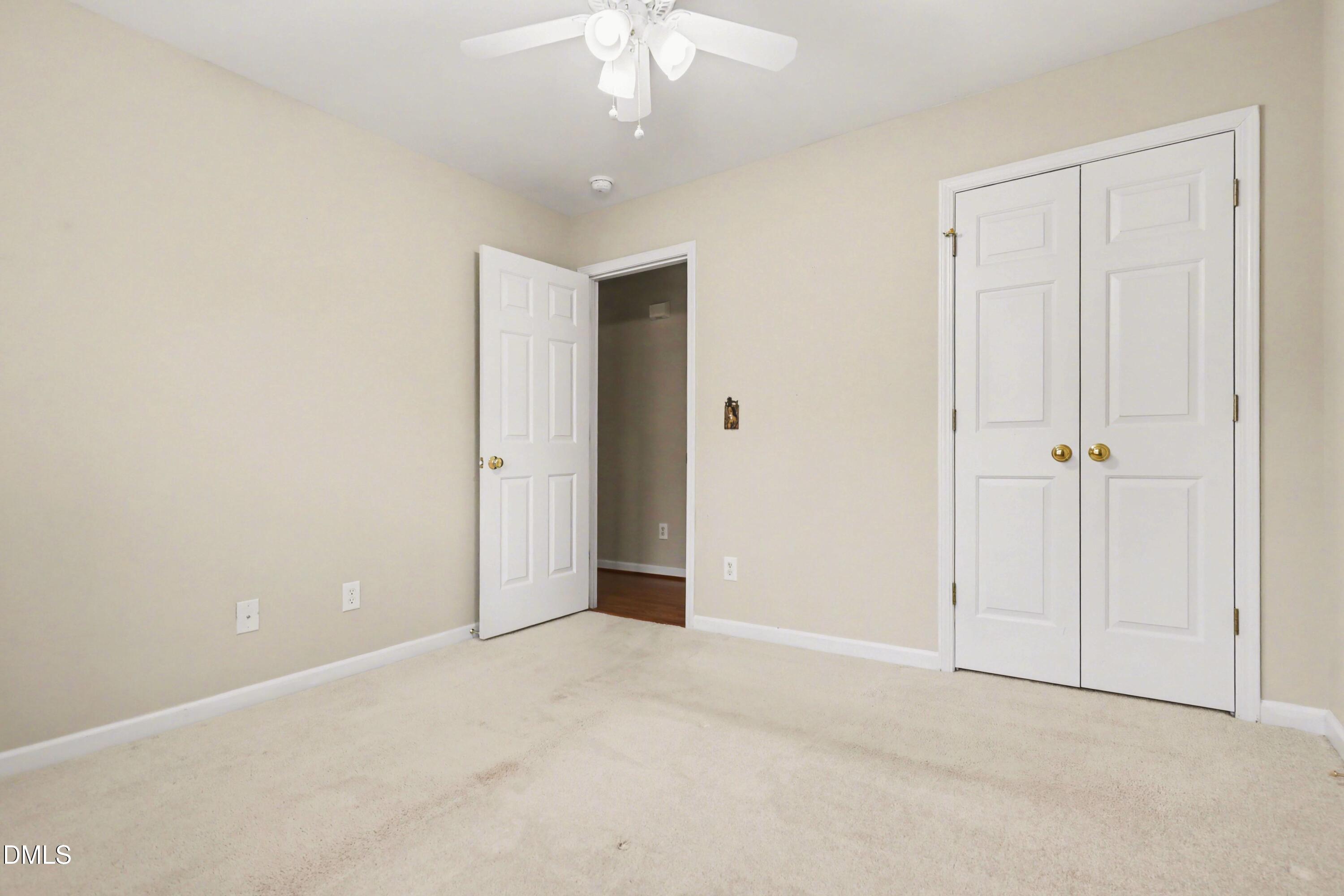 390 Eagle Stone Ridge Youngsville, NC 27596 - Photo 20 of 29 an empty room with a ceiling fan and entryway