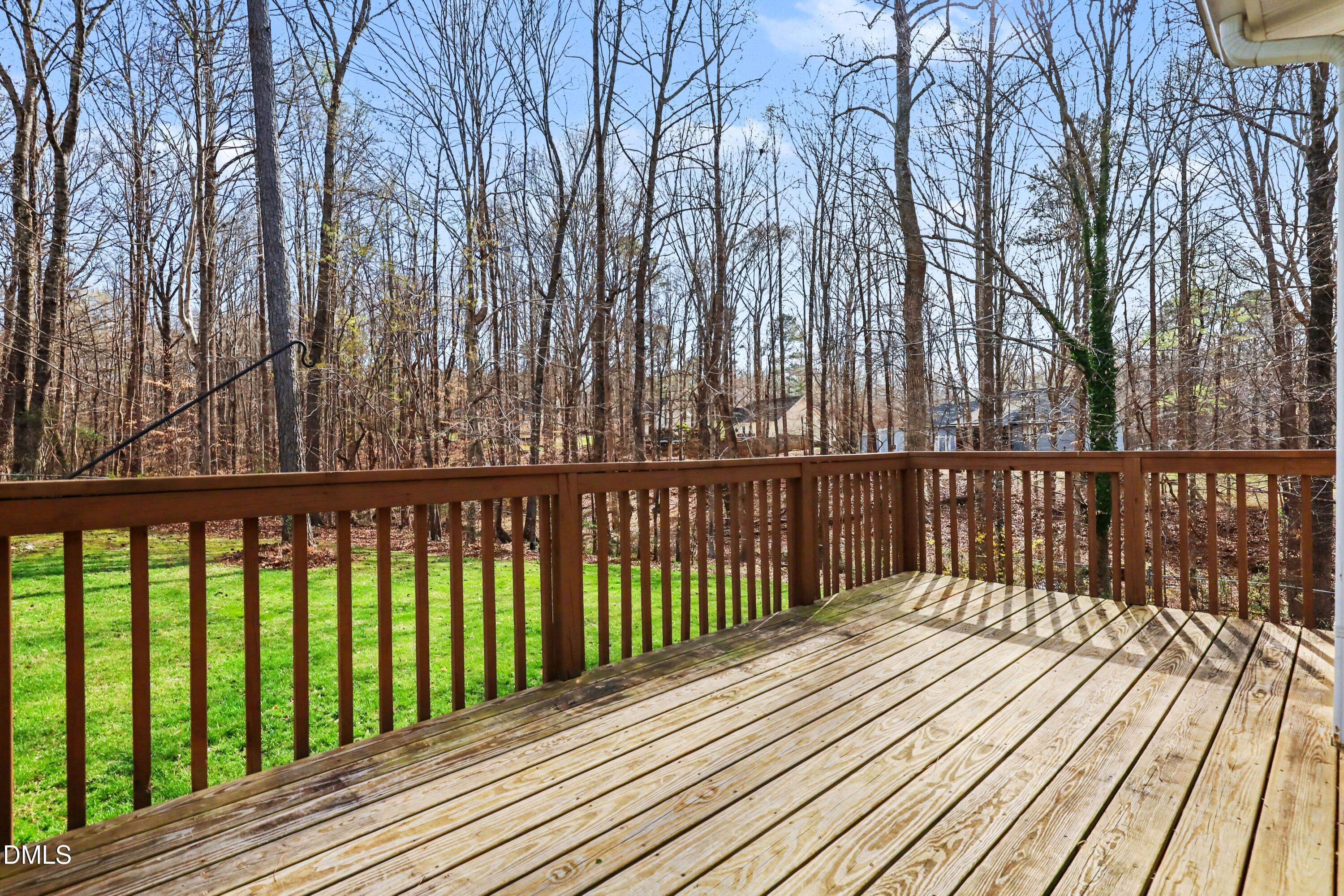 390 Eagle Stone Ridge Youngsville, NC 27596 - Photo 25 of 29 a balcony with wooden floor and trees