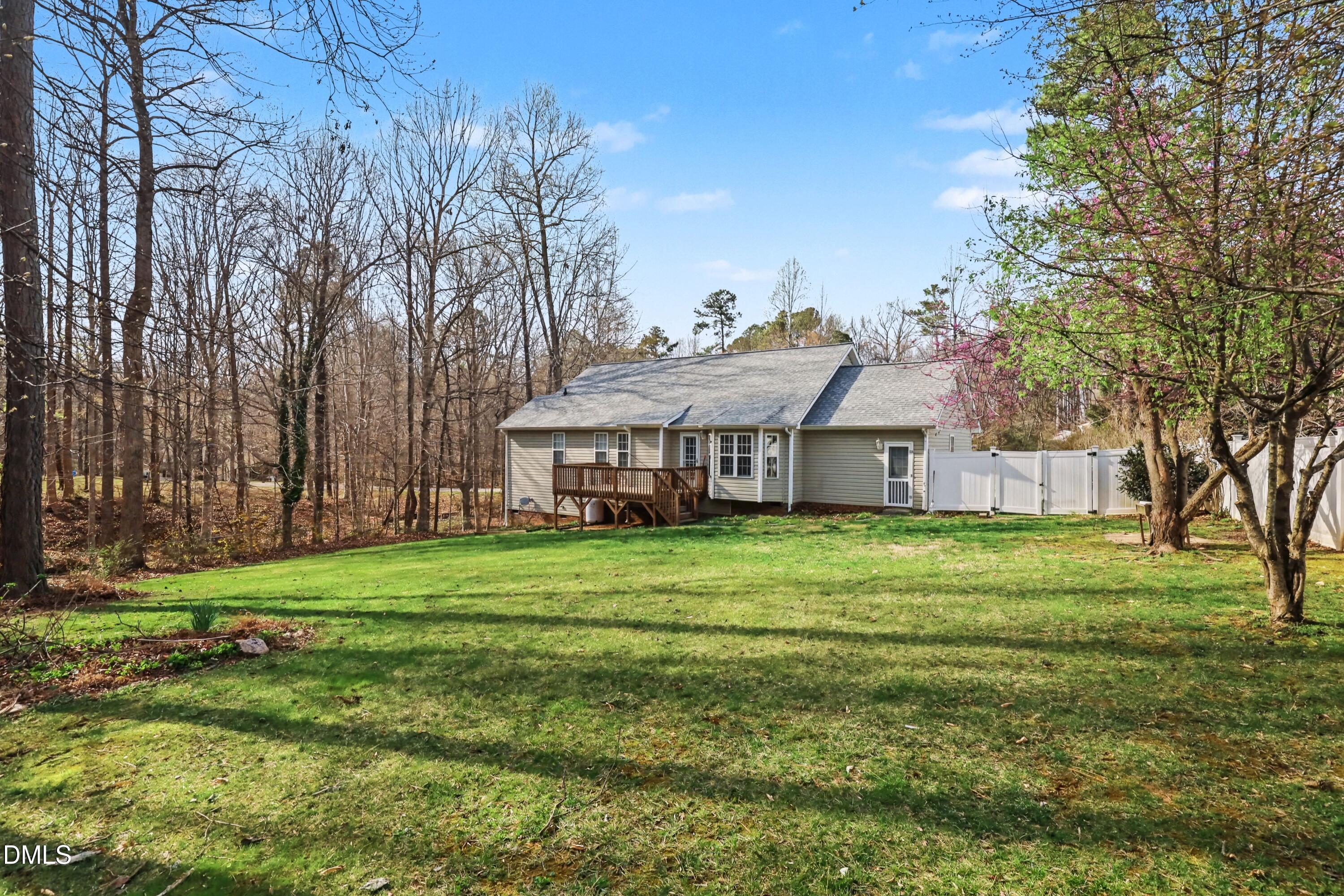 390 Eagle Stone Ridge Youngsville, NC 27596 - Photo 27 of 29 a front view of a house with a garden