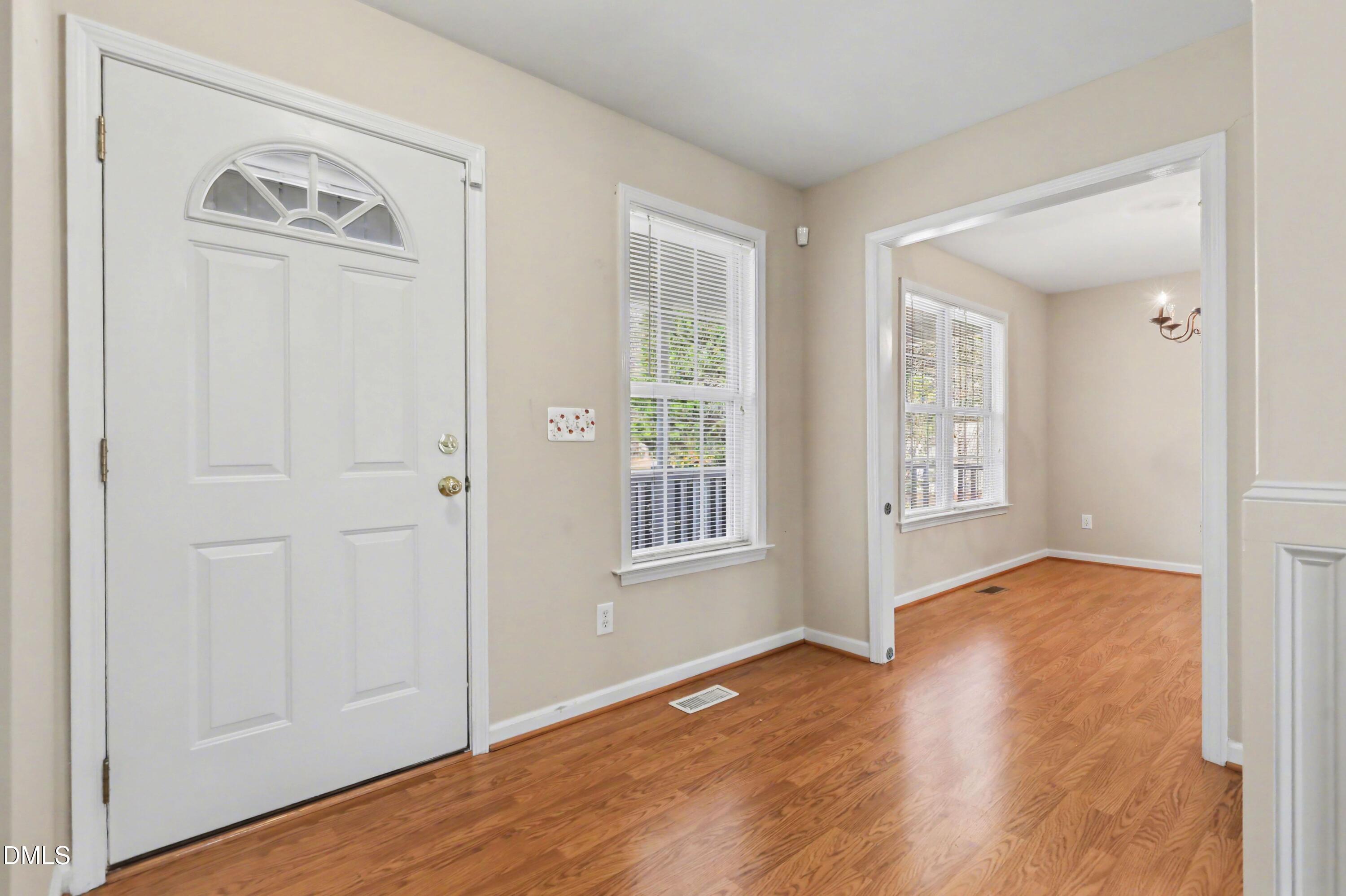 390 Eagle Stone Ridge Youngsville, NC 27596 - Photo 4 of 29 an empty room with wooden floor closet and windows