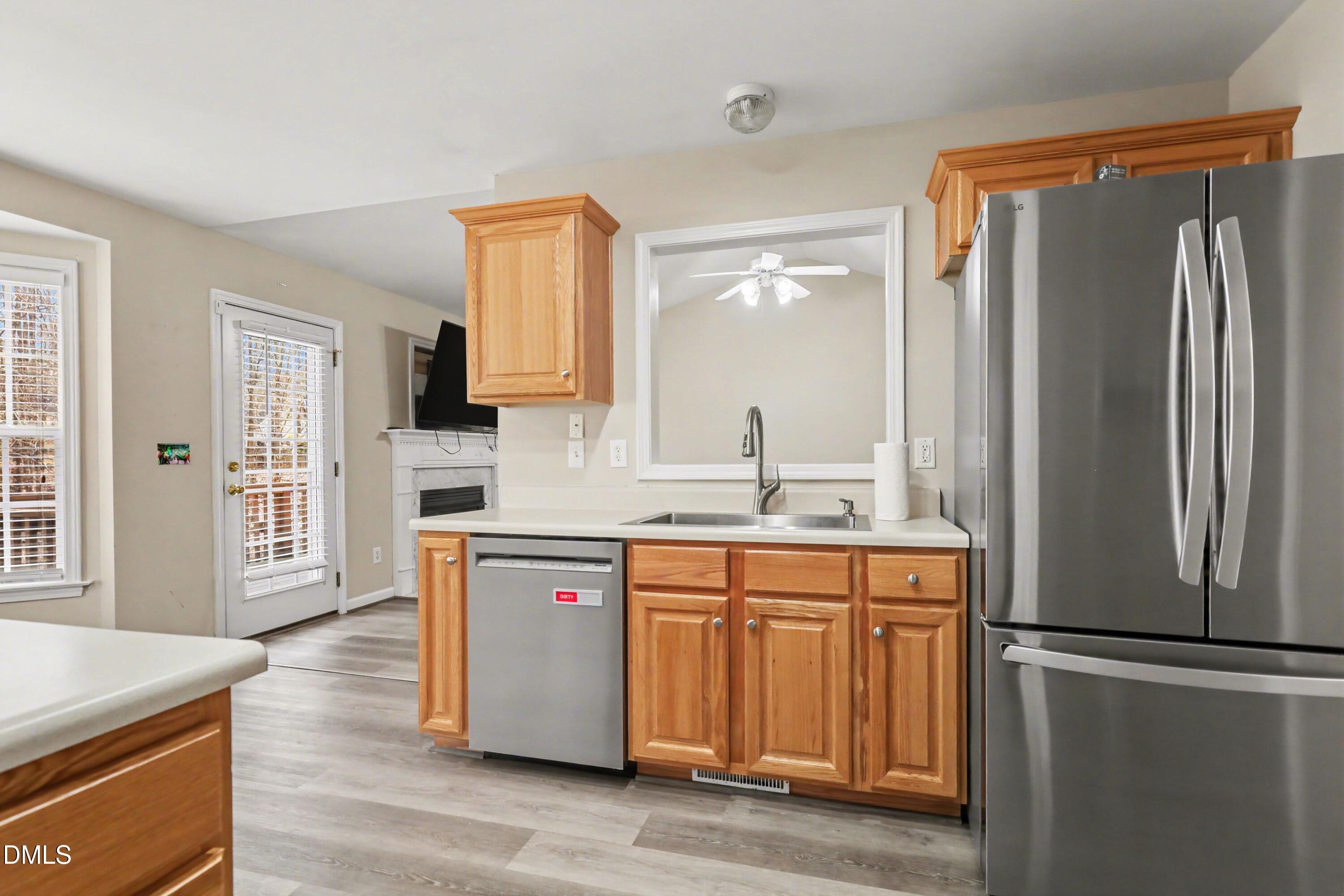 390 Eagle Stone Ridge Youngsville, NC 27596 - Photo 9 of 29 a kitchen with stainless steel appliances a refrigerator sink and cabinets