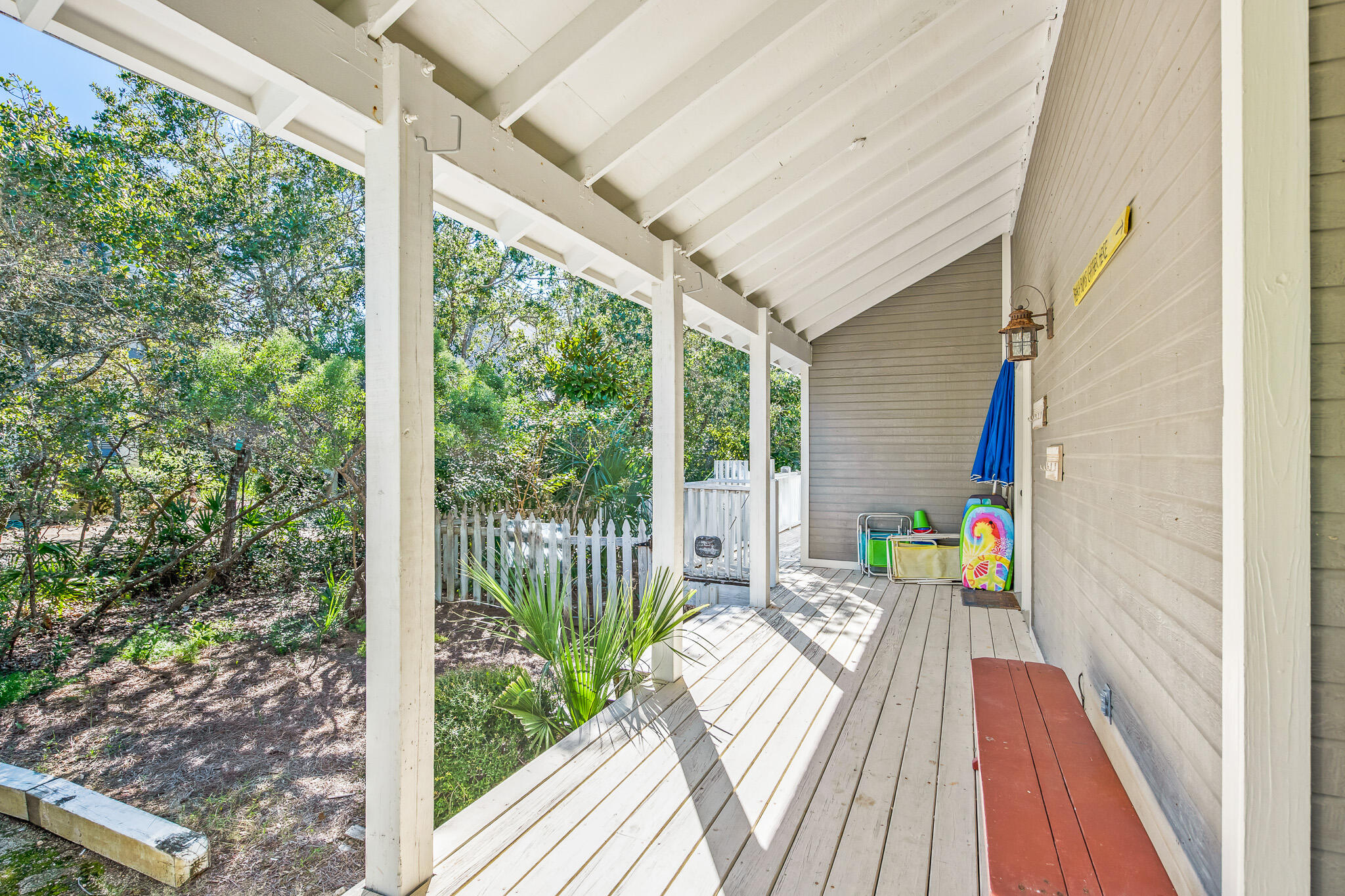 54 Sand Dunes Road Santa Rosa Beach, FL 32459 - Photo 4 of 22 a balcony with wooden floor table and chairs