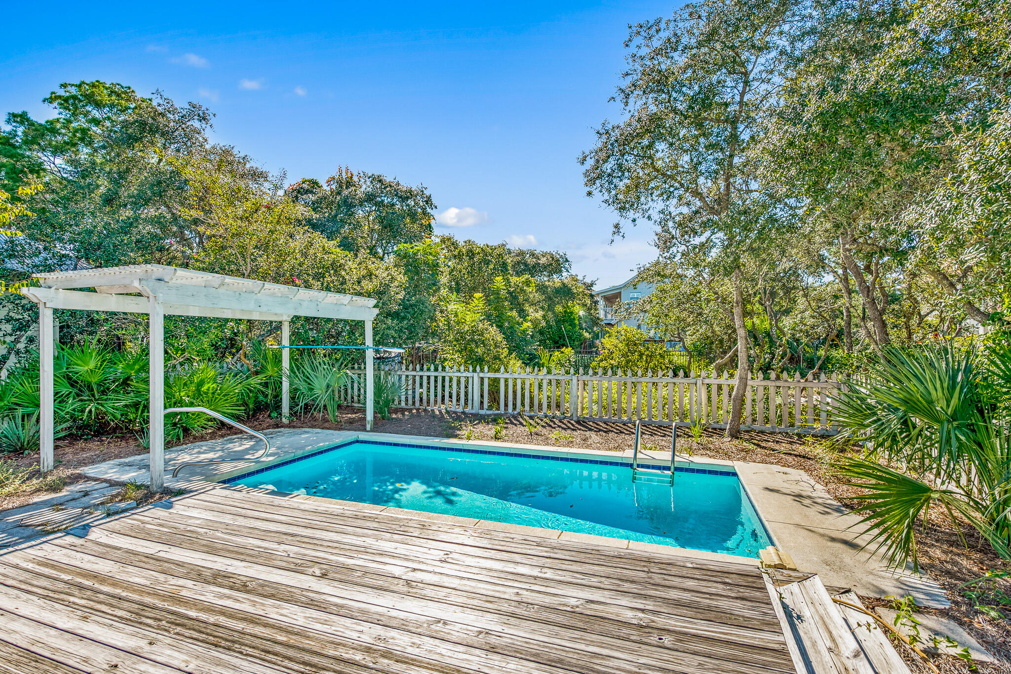 54 Sand Dunes Road Santa Rosa Beach, FL 32459 - Photo 5 of 22 a view of a backyard with a slide