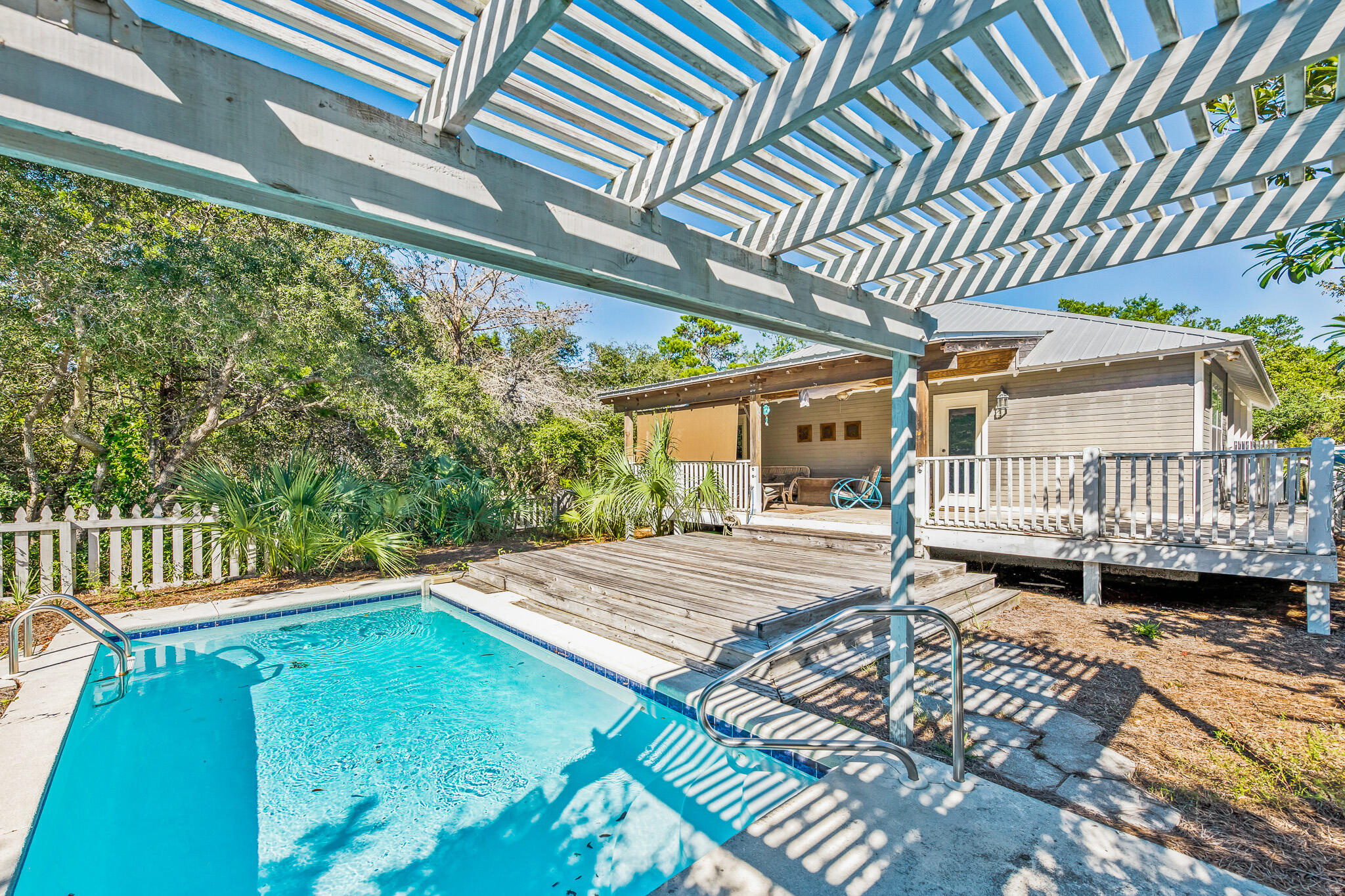 54 Sand Dunes Road Santa Rosa Beach, FL 32459 - Photo 6 of 22 a view of a patio with wooden floor