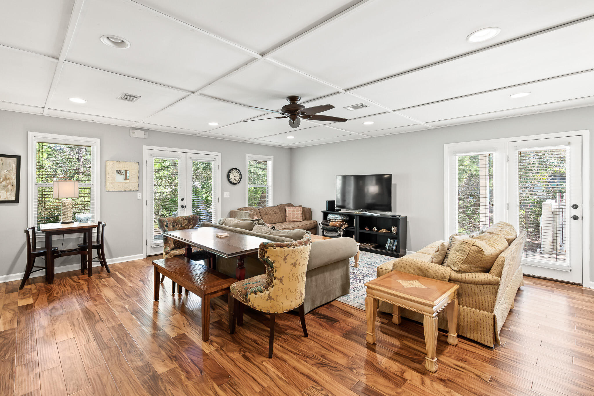 54 Sand Dunes Road Santa Rosa Beach, FL 32459 - Photo 7 of 22 a living room with furniture a flat screen tv and wooden floor