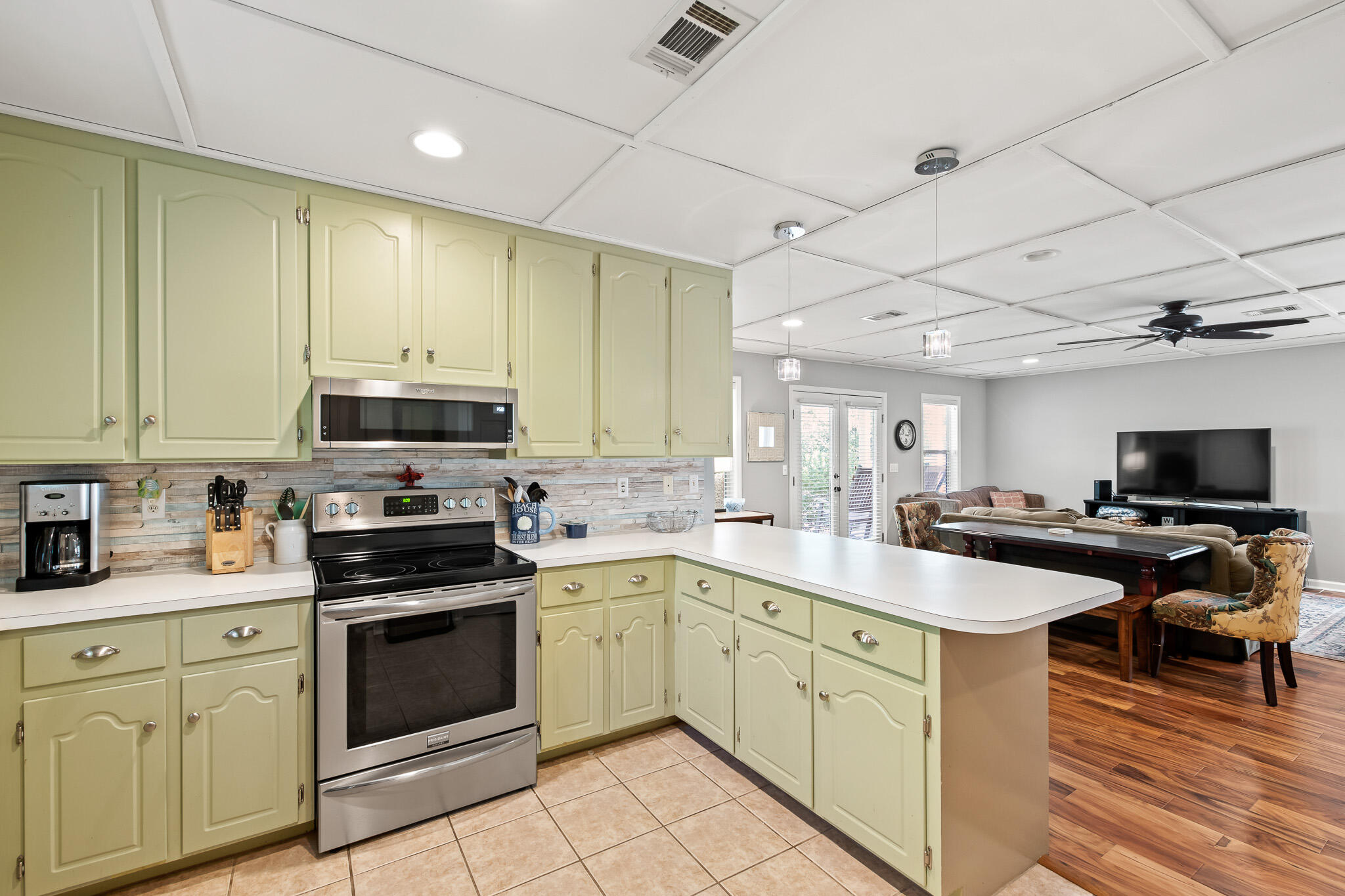 54 Sand Dunes Road Santa Rosa Beach, FL 32459 - Photo 10 of 22 a kitchen with stainless steel appliances a stove sink microwave and cabinets