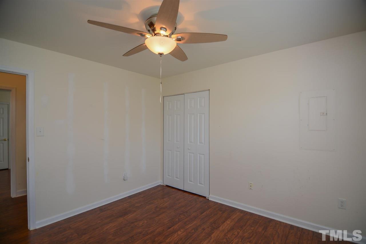 4412 Archibald Way Raleigh, NC 27616 - Photo 13 of 25 a view of an empty room with wooden floor