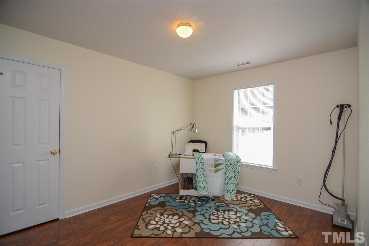 4412 Archibald Way Raleigh, NC 27616 - Photo 14 of 25 a room with furniture and a window
