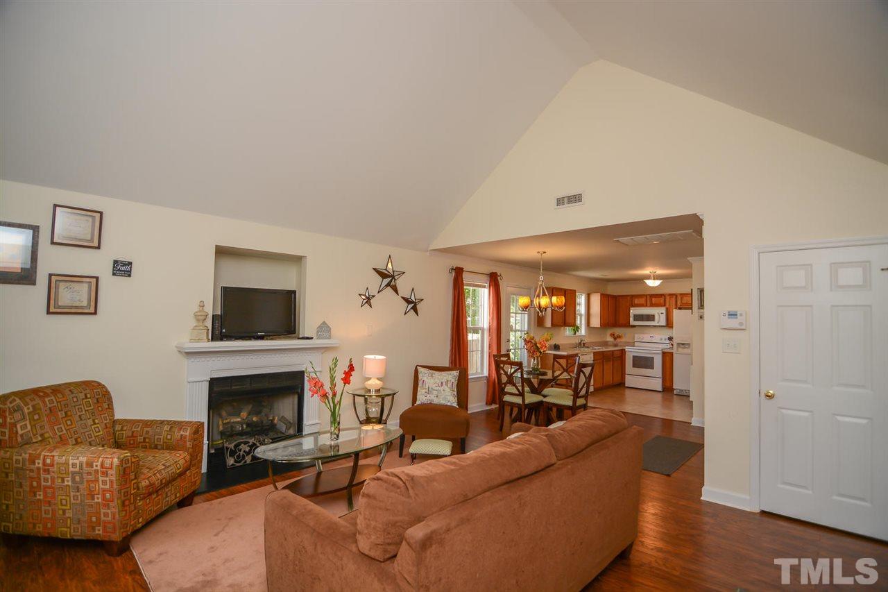 4412 Archibald Way Raleigh, NC 27616 - Photo 3 of 25 a living room with furniture and a fireplace
