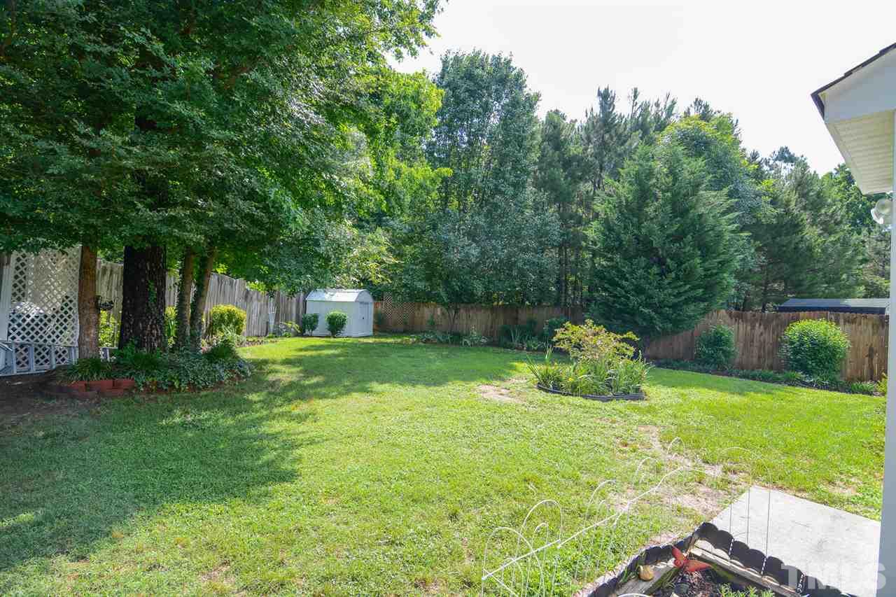 4412 Archibald Way Raleigh, NC 27616 - Photo 21 of 25 a view of a house with backyard and sitting area
