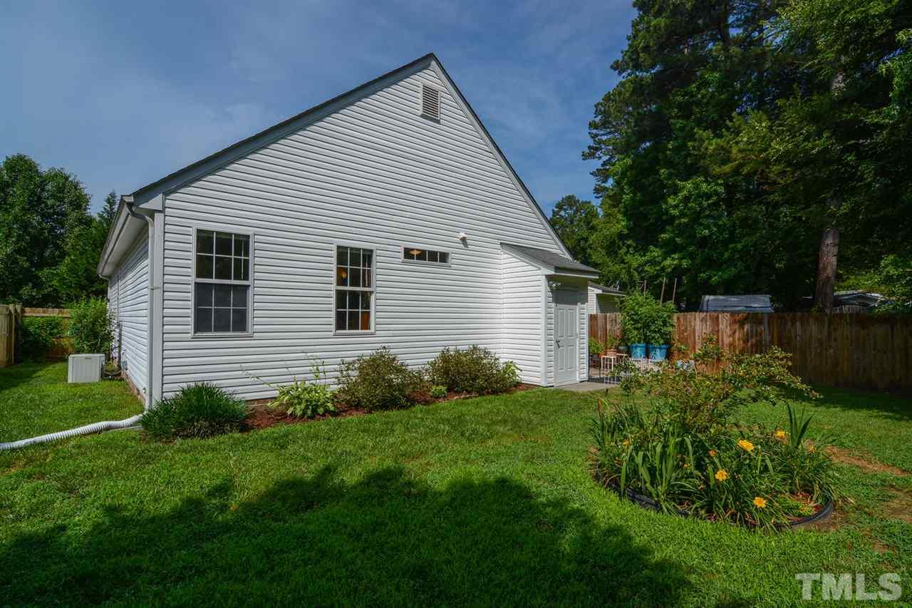 4412 Archibald Way Raleigh, NC 27616 - Photo 24 of 25 a view of backyard with potted plants and a large tree