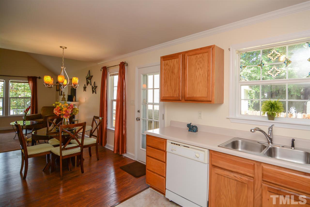 4412 Archibald Way Raleigh, NC 27616 - Photo 8 of 25 a kitchen that has a lot of cabinets a sink and appliances in it
