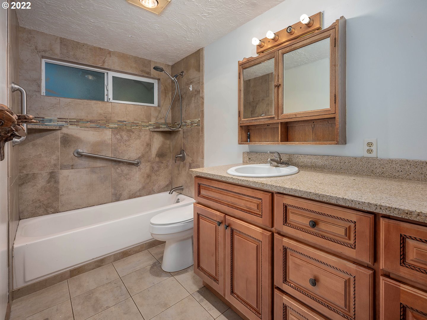 72293 Lentz Road Rainier, OR 97048 - Photo 17 of 22 a bathroom with a granite countertop toilet sink and mirror