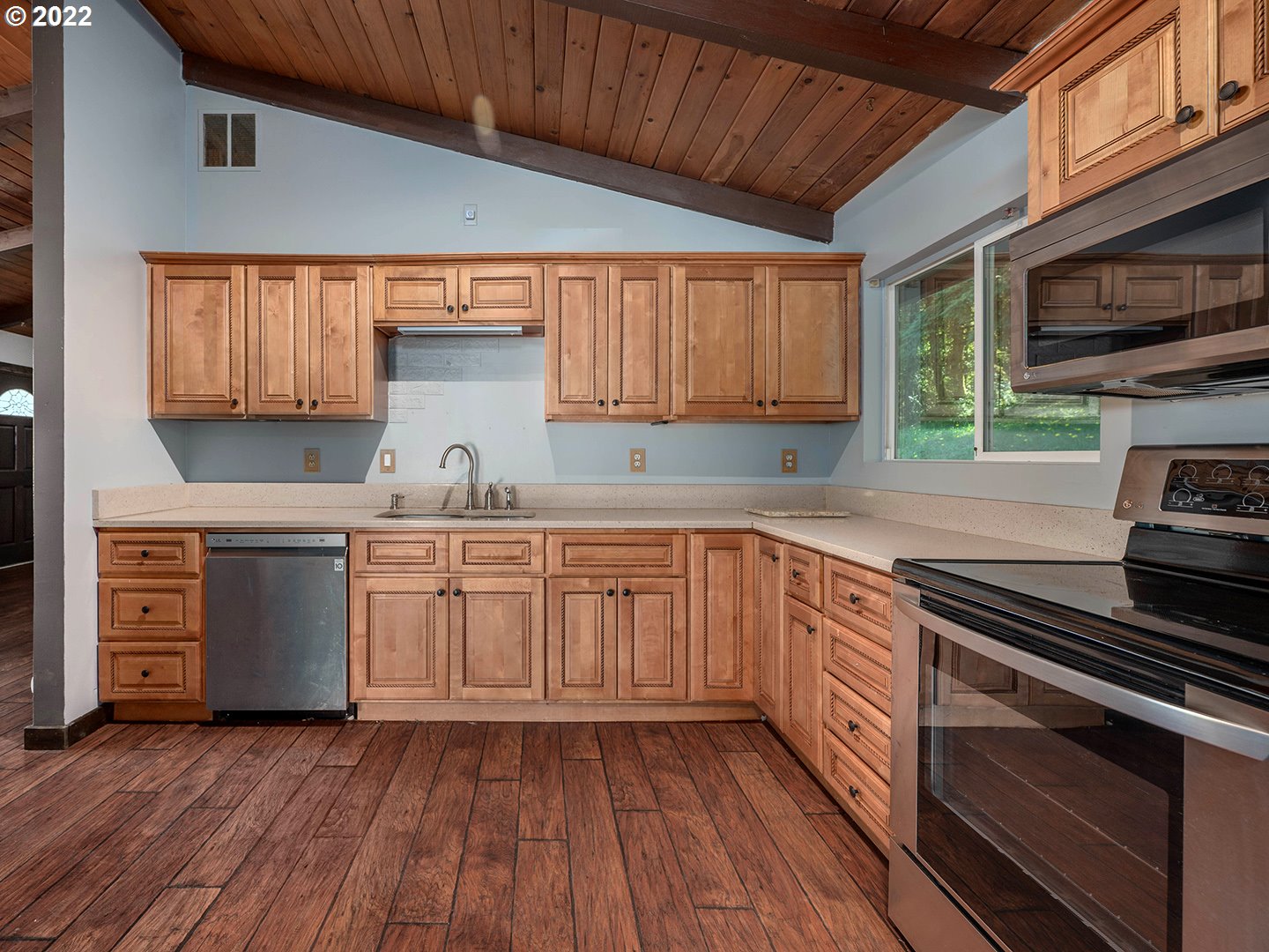 72293 Lentz Road Rainier, OR 97048 - Photo 9 of 22 a kitchen with wooden floors and a stove top oven