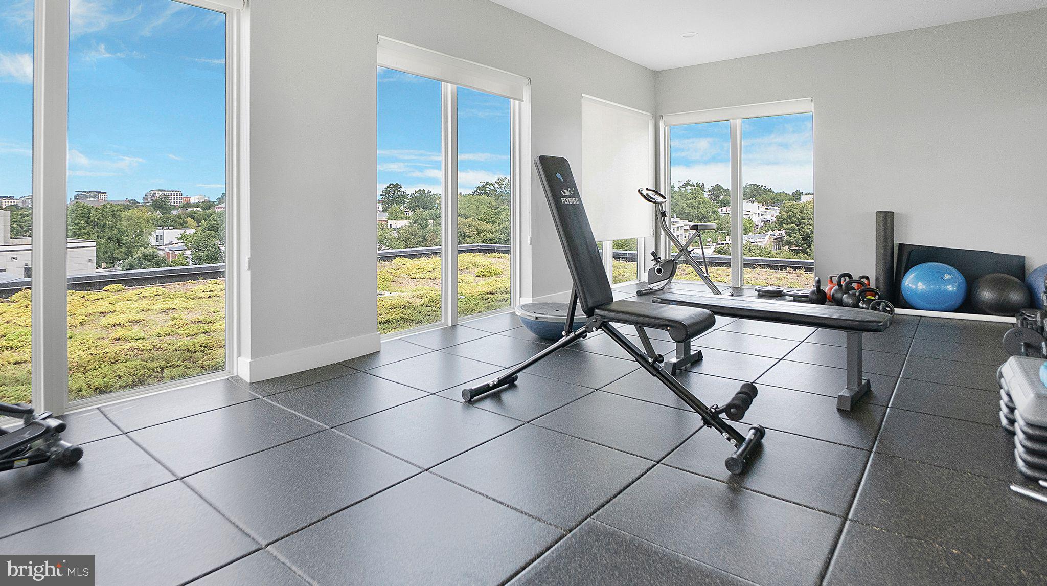 1111 Orren Street Northeast, Unit 407 Washington, DC 20002 - Photo 14 of 19 a view of a living room with a floor to ceiling window and floor to ceiling window