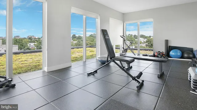 a view of a living room with a floor to ceiling window and floor to ceiling window
