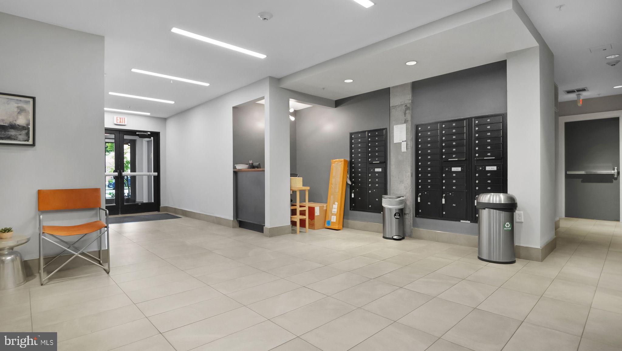 1111 Orren Street Northeast, Unit 407 Washington, DC 20002 - Photo 17 of 19 a view of a lobby with furniture and chandelier