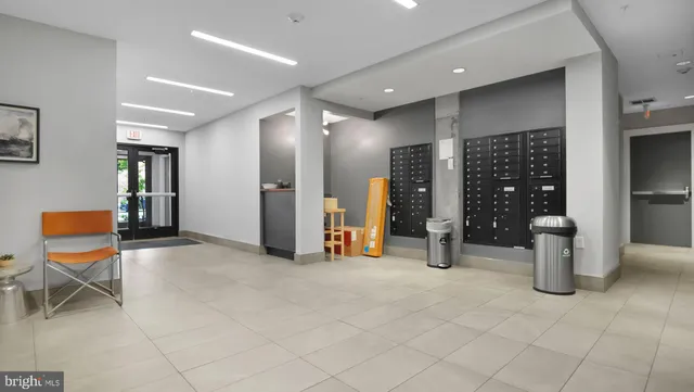 a view of a lobby with furniture and chandelier