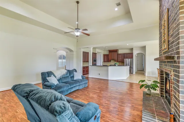 a view of a porch with furniture and garden
