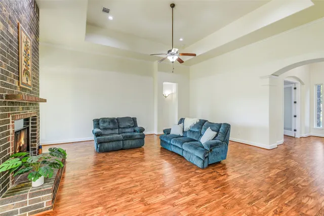 a view of a green field with wooden fence