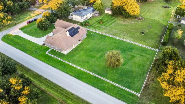 a front view of a house with a potted plant